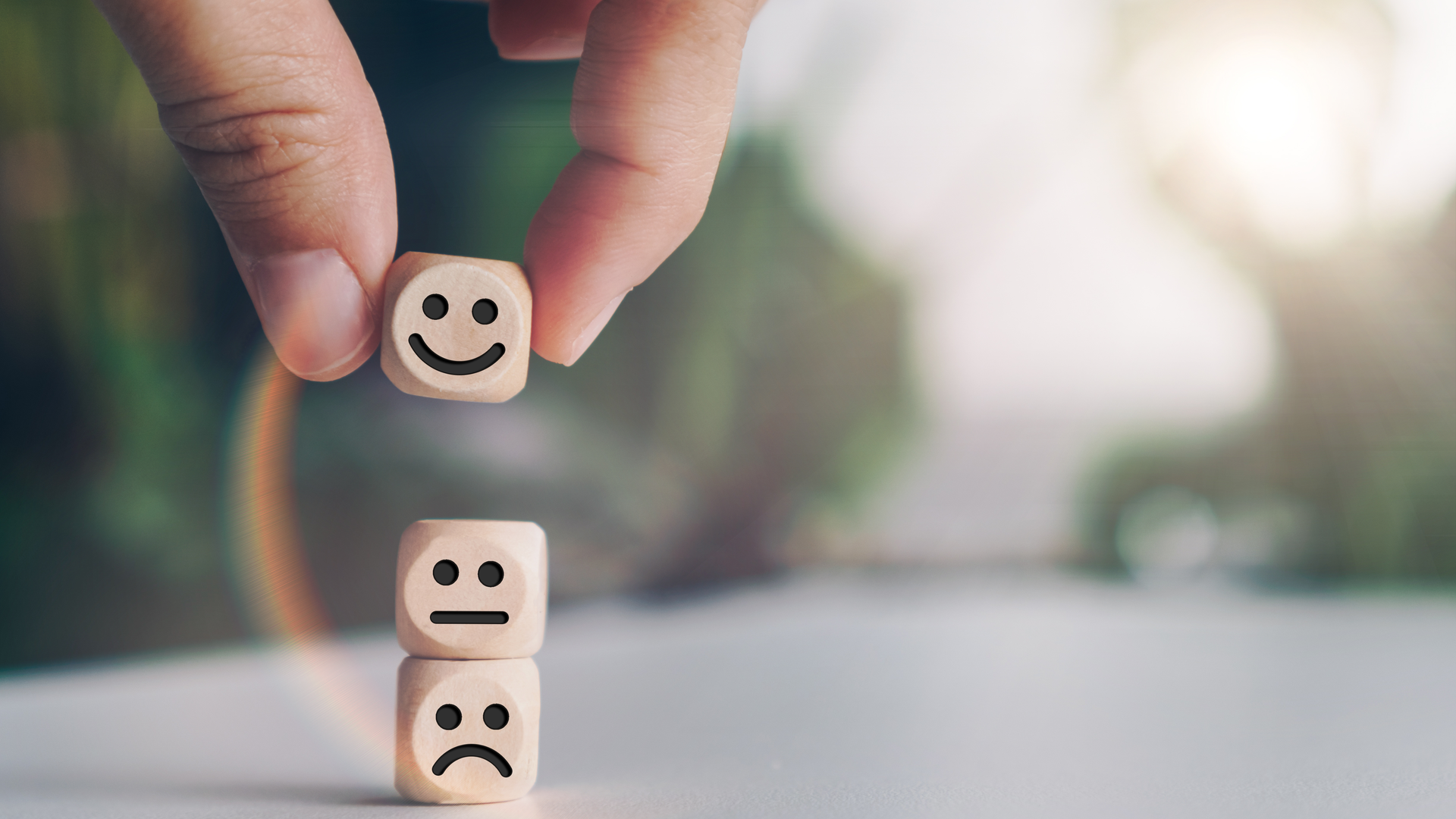 Smile face and cart icon on wood cube.